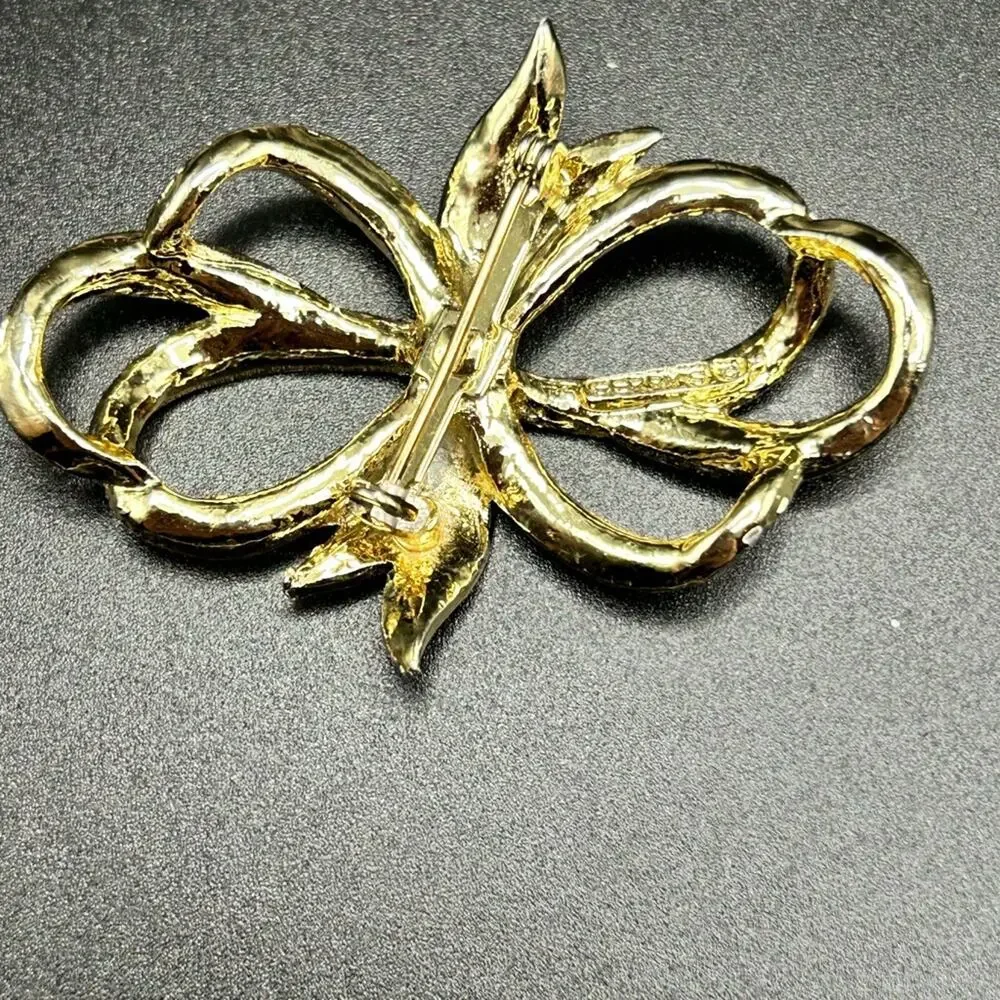 L0175 Gerry’s Brooch gold tone bow 2 1/4” Vintage